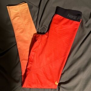 Nike Orange and Black Leggings